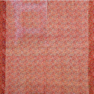 Intricate red rug with large repeating floral motifs bordered by dense traditional red paisley patterns.