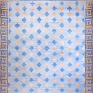 A blue and tan rug with repeating lozenge shapes and a thick Greek key border.