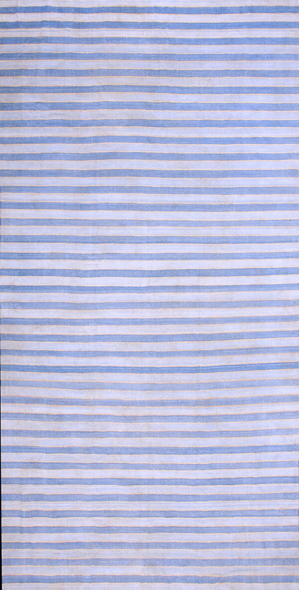 Rectangular rug featuring alternating vertical stripes in blue and pale cream.
