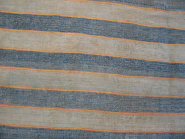 Low-pile rug featuring horizontal dusty blue and beige stripes separated by thin orange bands.