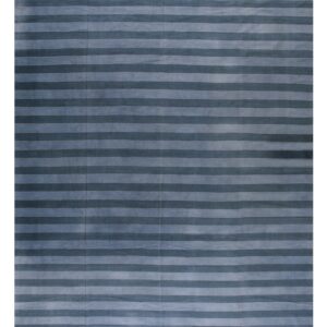 Textured low pile rug with wide horizontal stripes in alternating dark and light blue shades.