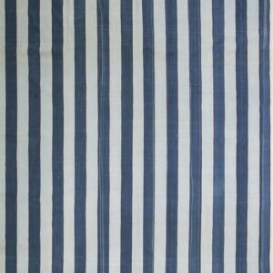 Low-pile textile displays alternating vertical stripes in deep indigo and pale off-white.