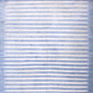 Faded blue and white rug with vertical stripes and small decorative dash motifs at both ends.
