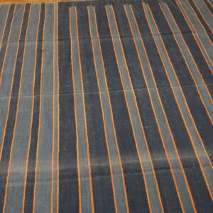 Low-pile rug featuring alternating dark and light blue stripes defined by thin orange lines.