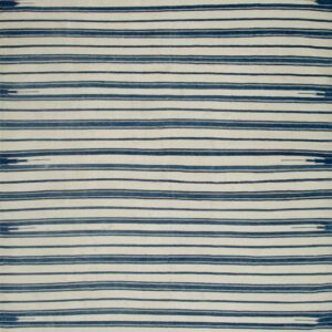 Flatweave rug with thick horizontal navy blue and cream stripes, seen over a dark wood floor.