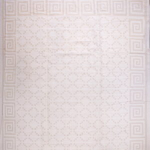 Light cream rug with a geometric Greek key border and subtle tone-on-tone field pattern.