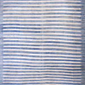 Flat blue and cream textile featuring abstract, diffused horizontal stripes.