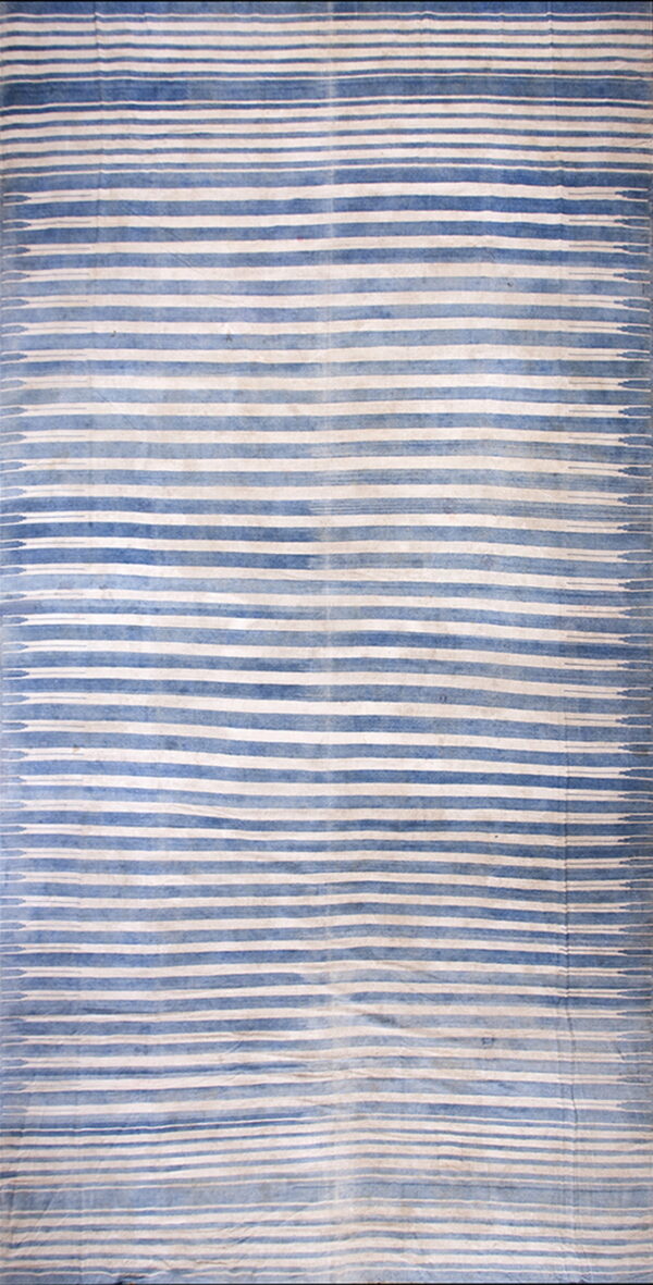 Flat blue and cream textile featuring abstract, diffused horizontal stripes.