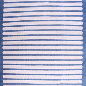 Blue and white striped flatweave rug showing solid blue borders and jagged interior edges.