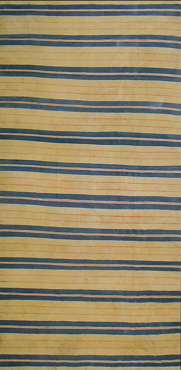 A low-pile runner rug featuring alternating broad horizontal stripes of light beige, dark blue, and thin red lines.
