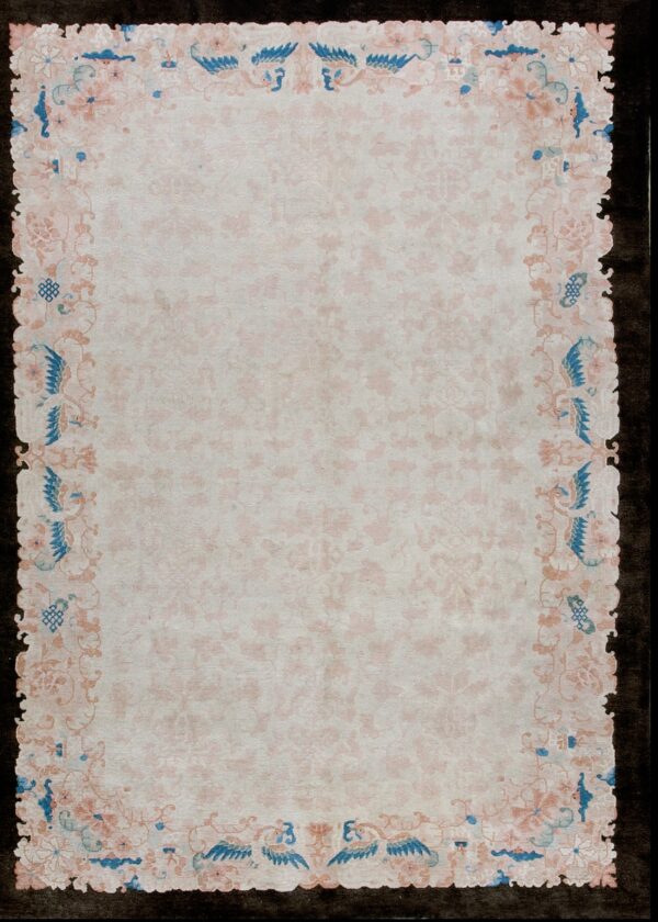 Elegant ivory rug with floral border.