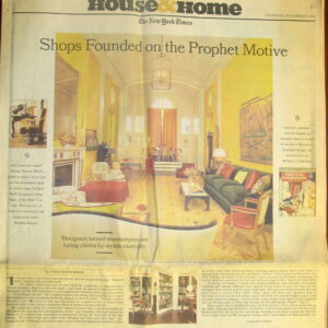 A subtle traditional patterned rug in pale gold tones anchors the grand yellow room and scattered furniture.