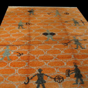 Shaggy orange rug patterned with white-outlined ovals and stylized dark gray figures.