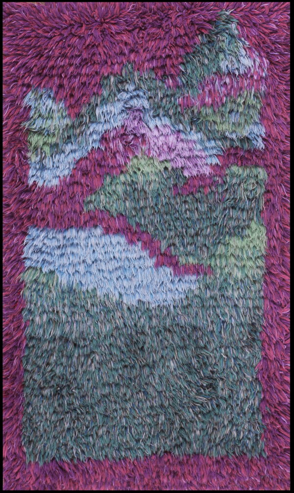 A shaggy, long-pile rug with a vibrant abstract pattern in magenta, dark purple, teal, and blue.