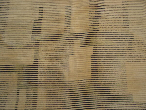 Textured beige and black patterned fabric