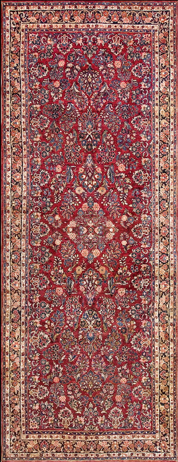 Low pile runner rug featuring an intricate traditional floral pattern on a rich burgundy field and cream borders.