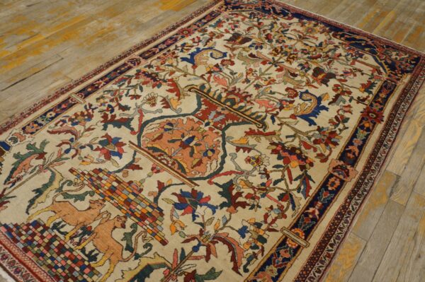 Traditional cream rug with colorful dense floral and fauna patterns resting on distressed wooden flooring.