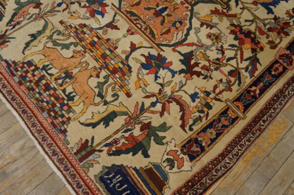 Beige rug featuring complex multicolored floral and stylized animal motifs rests on weathered wood planks.