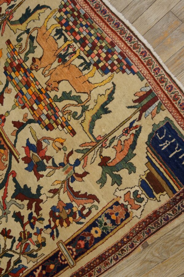 Cream rug with a colorful field pattern of stylized lions, floral vines, and checkered squares on wood floor.