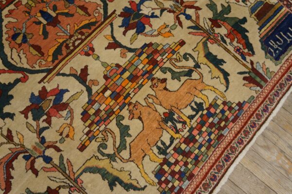 Detailed beige rug featuring colorful checkered geometry, tan leaping felines, and stylized red and blue designs.