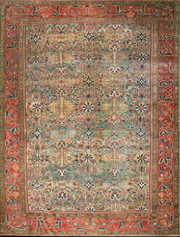 Intricate low-pile rug featuring a multi-colored teal field pattern and a vibrant red floral main border.