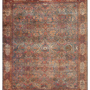 Traditional blue rug with an intricate all-over floral design and a rust border containing calligraphy cartouches.