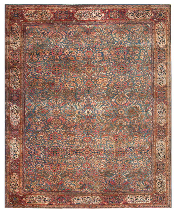 Traditional blue rug with an intricate all-over floral design and a rust border containing calligraphy cartouches.
