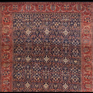 Intricate, low-pile traditional rug featuring a dark indigo geometric lattice and wide brick-red ornamental borders.