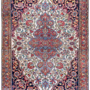 Highly detailed rug featuring a multicolored floral pattern on an ivory ground with a navy border.