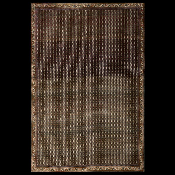 Dark brown rug with narrow vertical stripes and an elaborate multicolored geometric border against black.