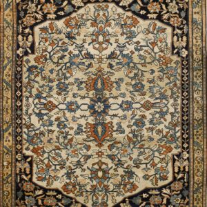Cream and navy blue rug featuring an intricate all-over floral pattern bordered by gold and tan motifs.