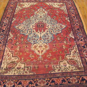 Intricate floral design on coral background