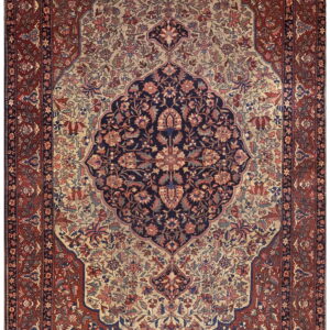 Ornate floral rug featuring a navy medallion, cream spandrels, and a complex rust-toned border.