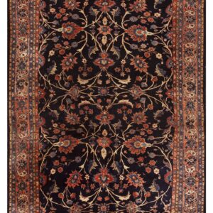 Dark blue runner rug featuring an elaborate field of terracotta, gold, and blue traditional scrolling vines.