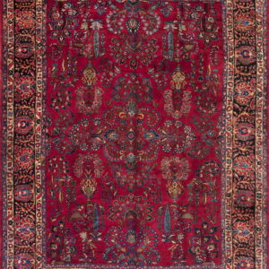 Intricate red rug featuring an all-over botanical pattern and multi-layered black and gold borders.