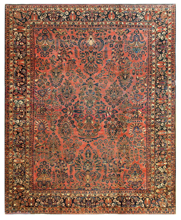 Terracotta rug with an intricate navy and rust floral design, bordered by multiple dark bands.