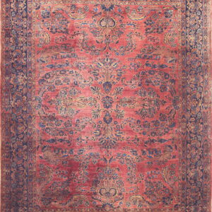 Ornate red rug with a low pile and complex blue and gold botanical patterns and borders.