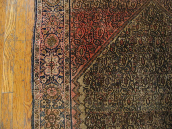 Intricate patterns on aged wool rug