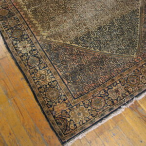 Vintage rug with intricate floral patterns.