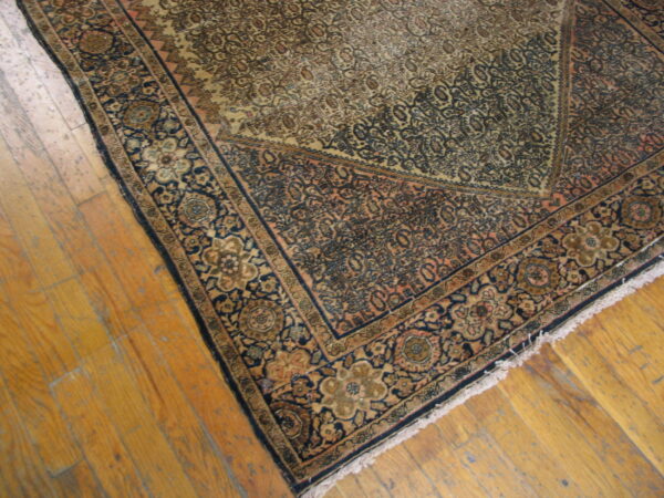 Vintage rug with intricate floral patterns.