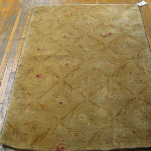 Textured olive green patterned area rug