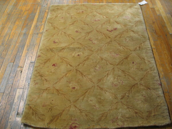 Textured olive green patterned area rug