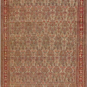 Traditional rug featuring an all-over stylized pattern of red, pink, and ivory, framed by a thick red border.