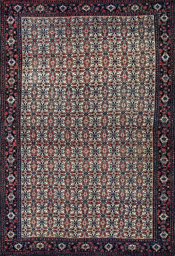 Low-pile rug with a cream field, dense red and blue geometric pattern, and intricate dark blue borders.