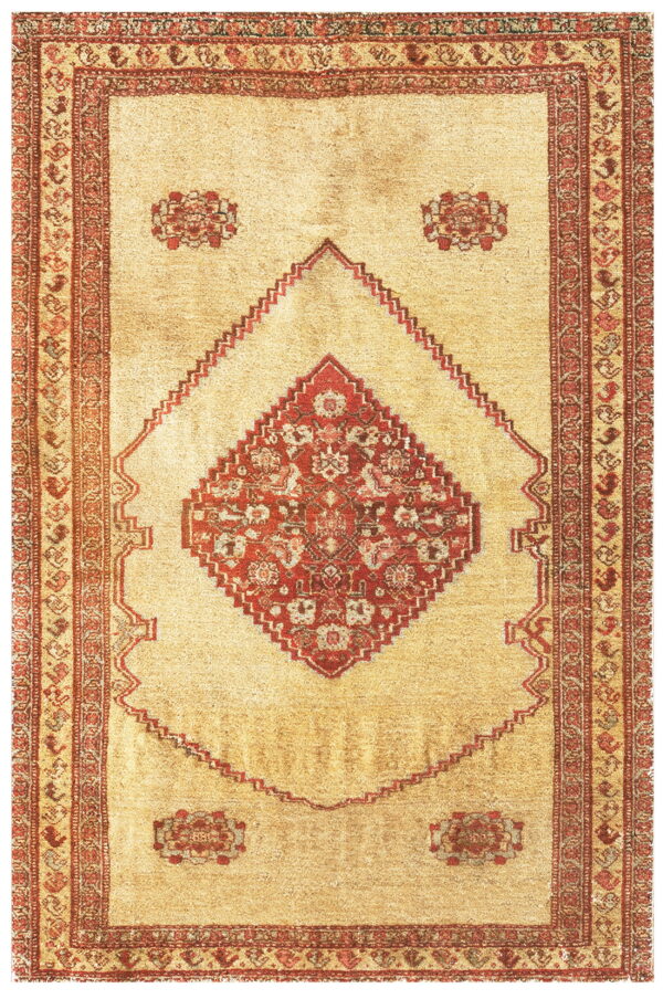 Beige rug featuring a large central red stepped medallion and complex geometric borders.