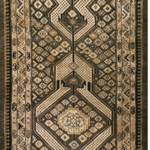 Muted brown and tan runner rug with intricate geometric diamond patterns and stepped borders.