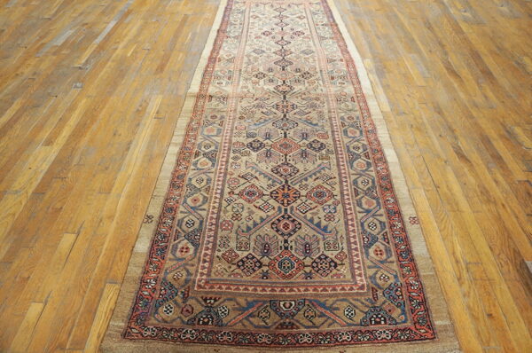 Intricate patterned vintage hallway runner rug