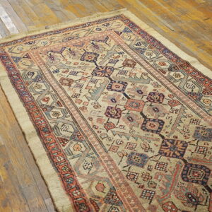 Colorful vintage rug on wooden floor