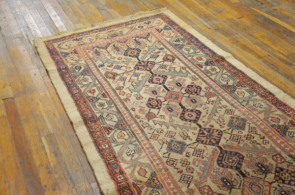 Colorful vintage rug on wooden floor