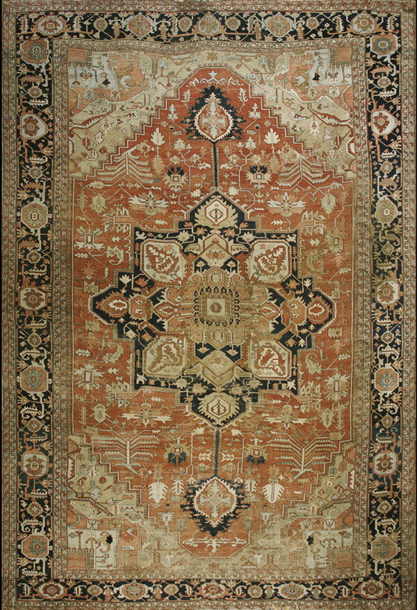 Traditional rust-colored rug with a large stepped medallion, detailed motifs, and a wide dark border.